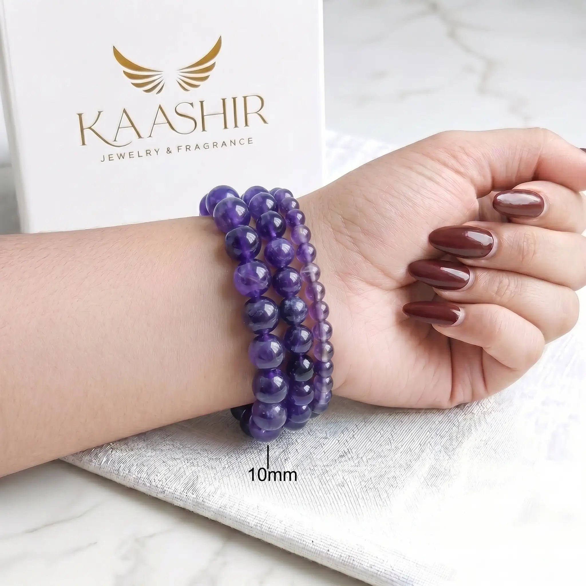 Amethyst 10mm Beaded Gemstone Bracelet worn on wrist – Kaashir Jewelry