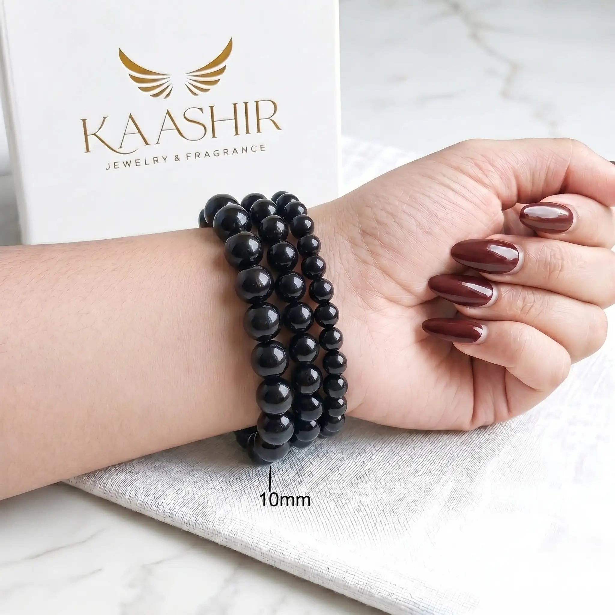 Black Obsidian 10mm Beaded Gemstone Bracelet worn on wrist – Kaashir Jewelry