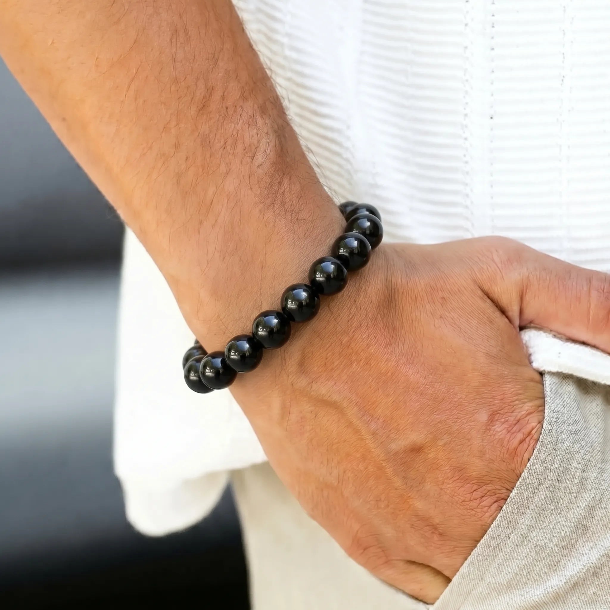 Black Obsidian 10mm Beaded Gemstone Bracelet worn on wrist – Kaashir Jewelry