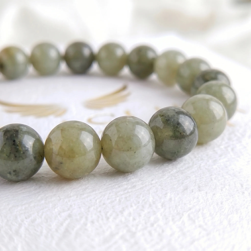 Close-up of natural labradorite beads showing colour variation — Kaashir gemstone bracelet