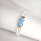 Clear quartz and aquamarine crystal beads catching light