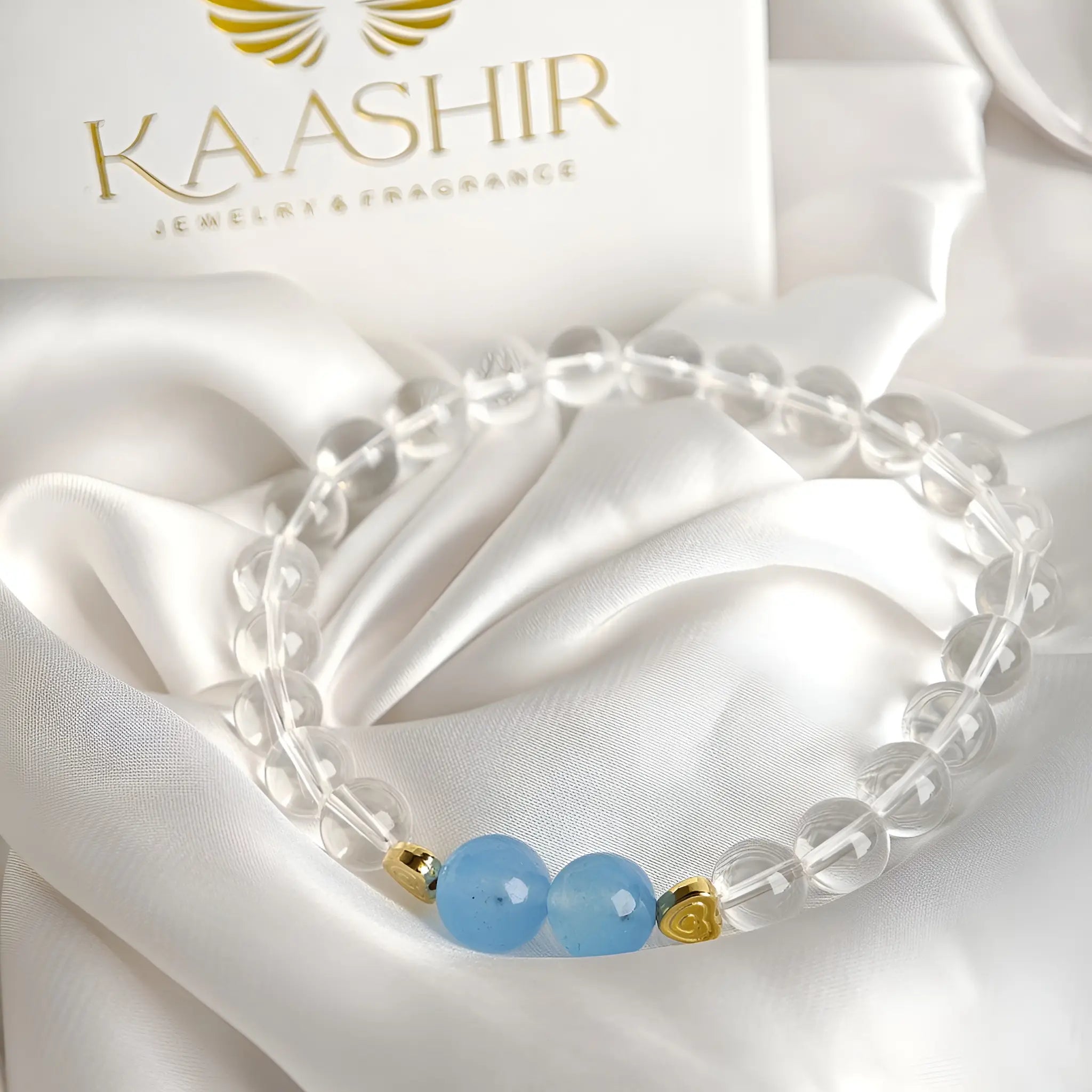 Aquamarine clear quartz bracelet with crystals on a white background