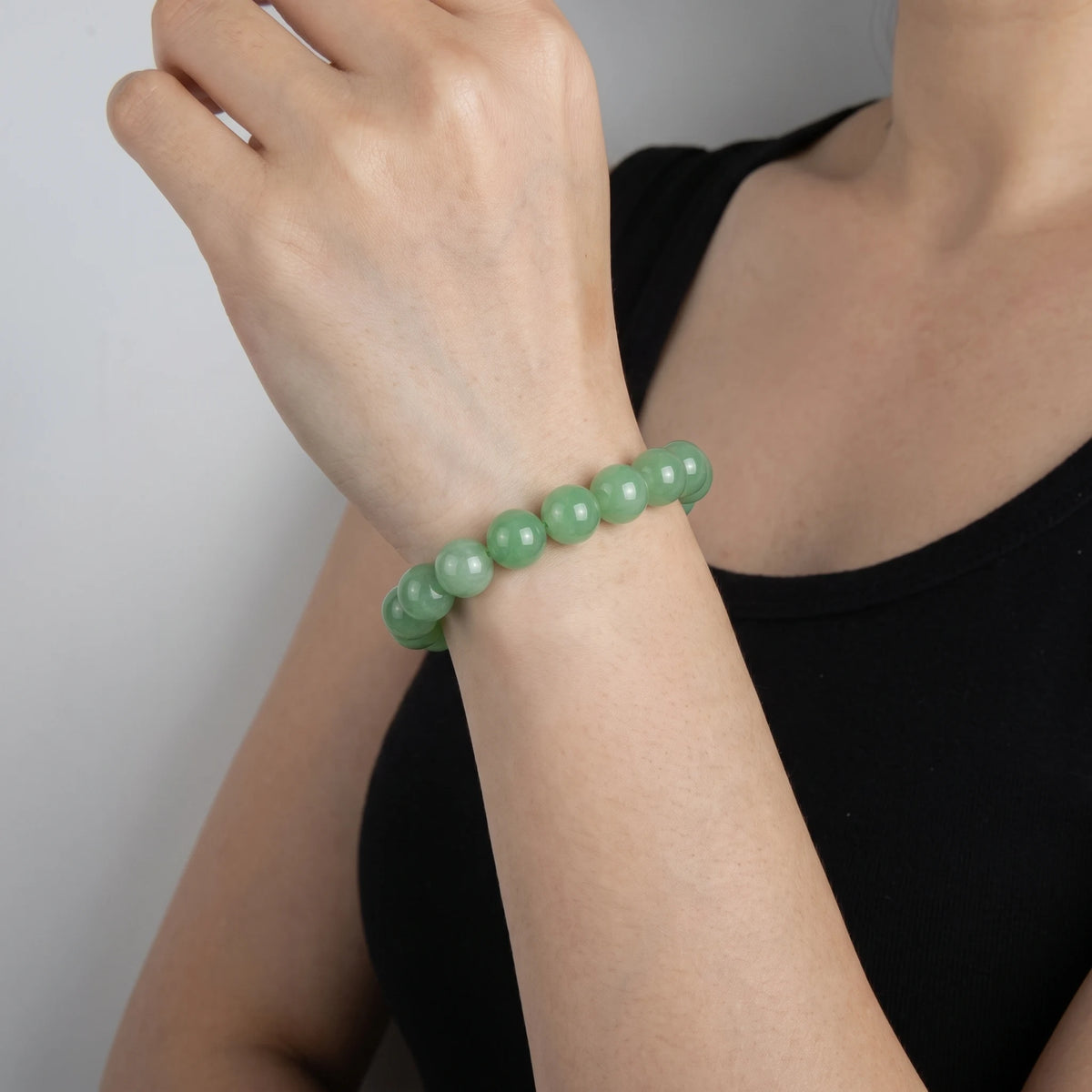 green aventurine 10mm beaded bracelet worn by women 