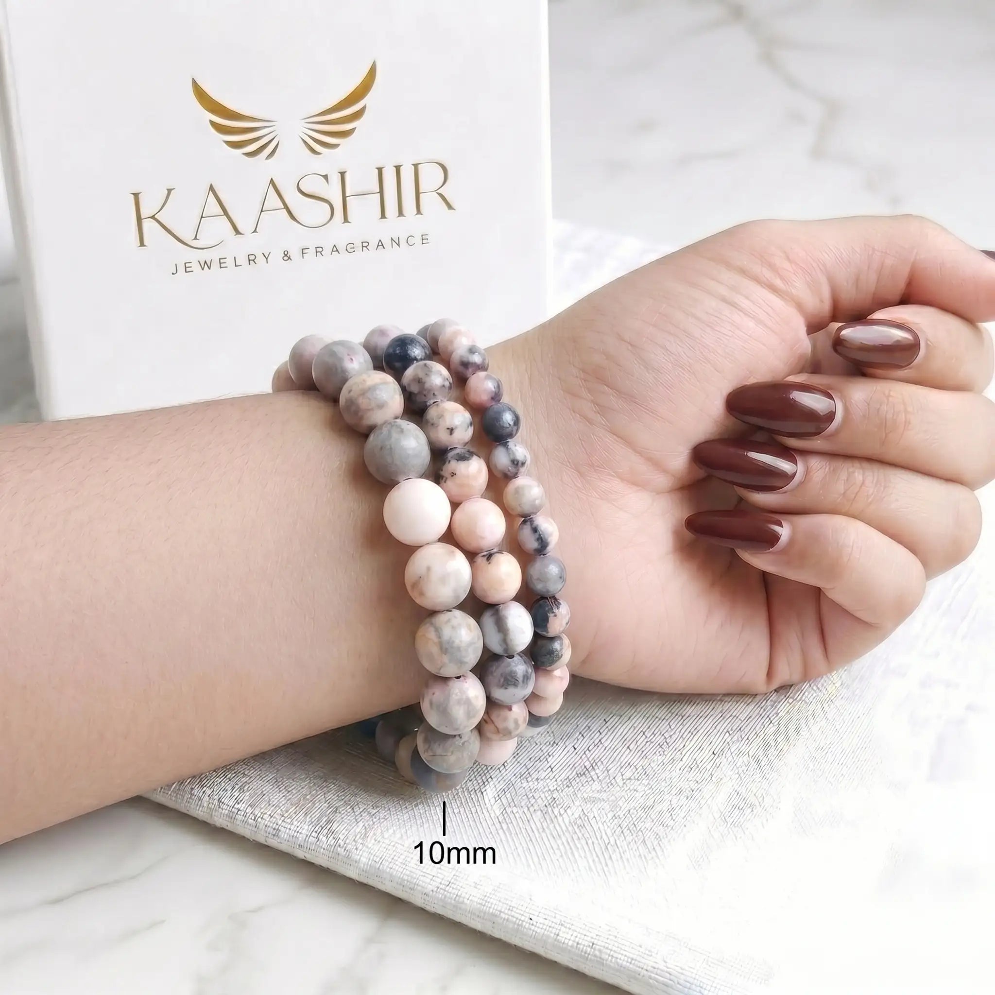Pink Zebra Jasper 10mm Beaded Gemstone Bracelet worn on wrist – Kaashir Jewelry