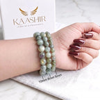 Woman wearing labradorite crystal bracelet — natural stone jewelry by Kaashir