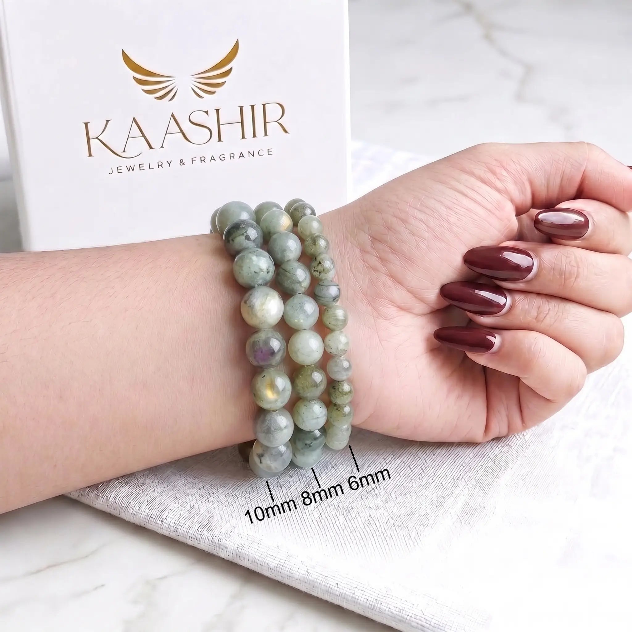 Woman wearing labradorite crystal bracelet — natural stone jewelry by Kaashir