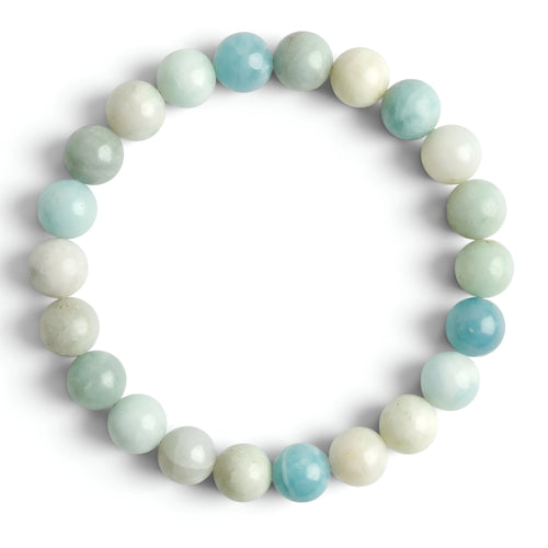 Beaded bracelet with green and white beads on a white background