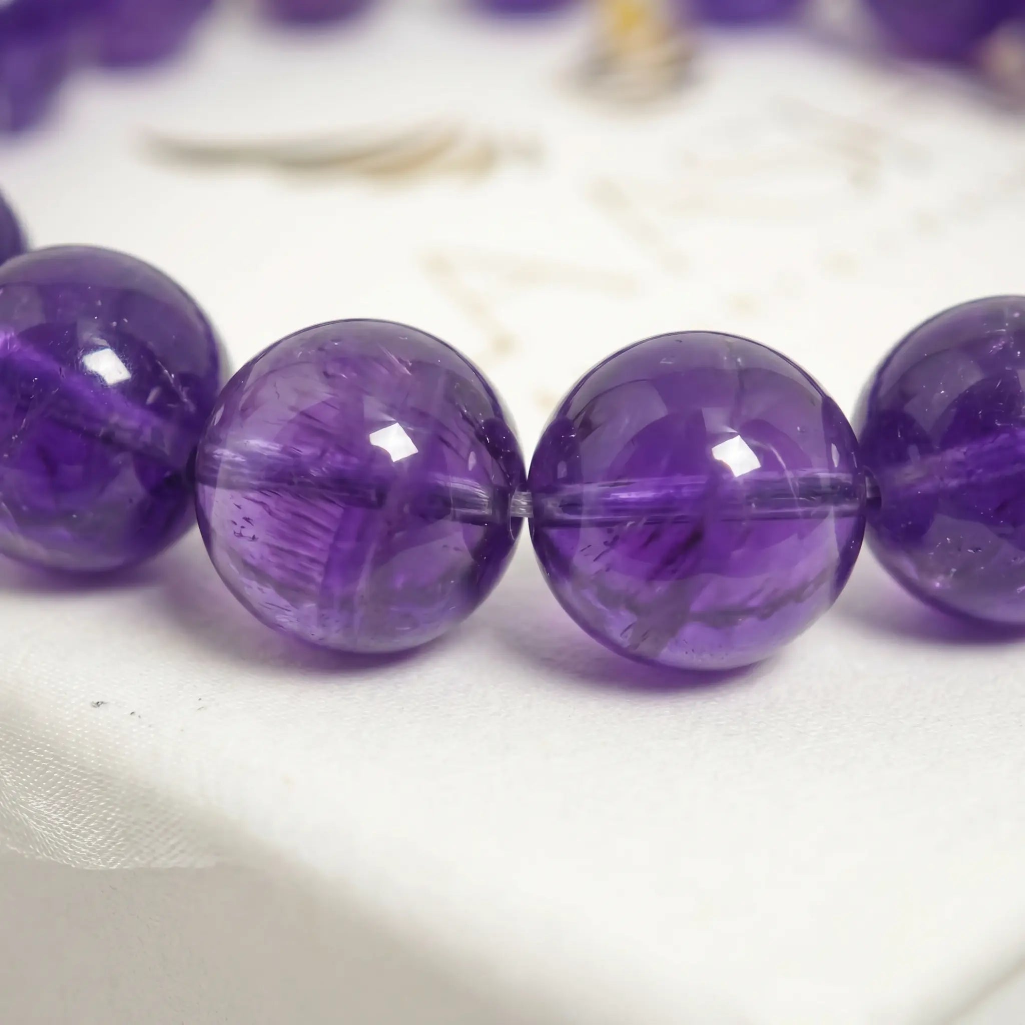 amethyst bracelet natural stone beads close up purple detail