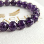 amethyst bracelet natural stone beads close up purple detail