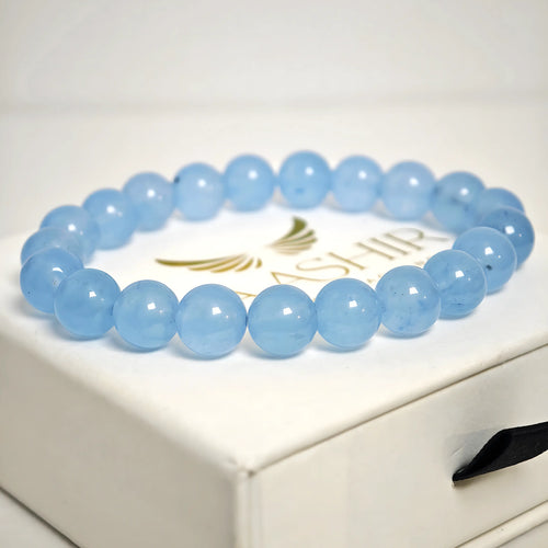 Close-up of Aquamarine beads showing light blue natural crystal texture and clarity