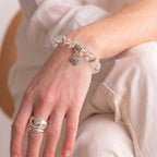 Clear quartz beaded charm bracelet lifestyle shot — handmade crystal bracelet for women
