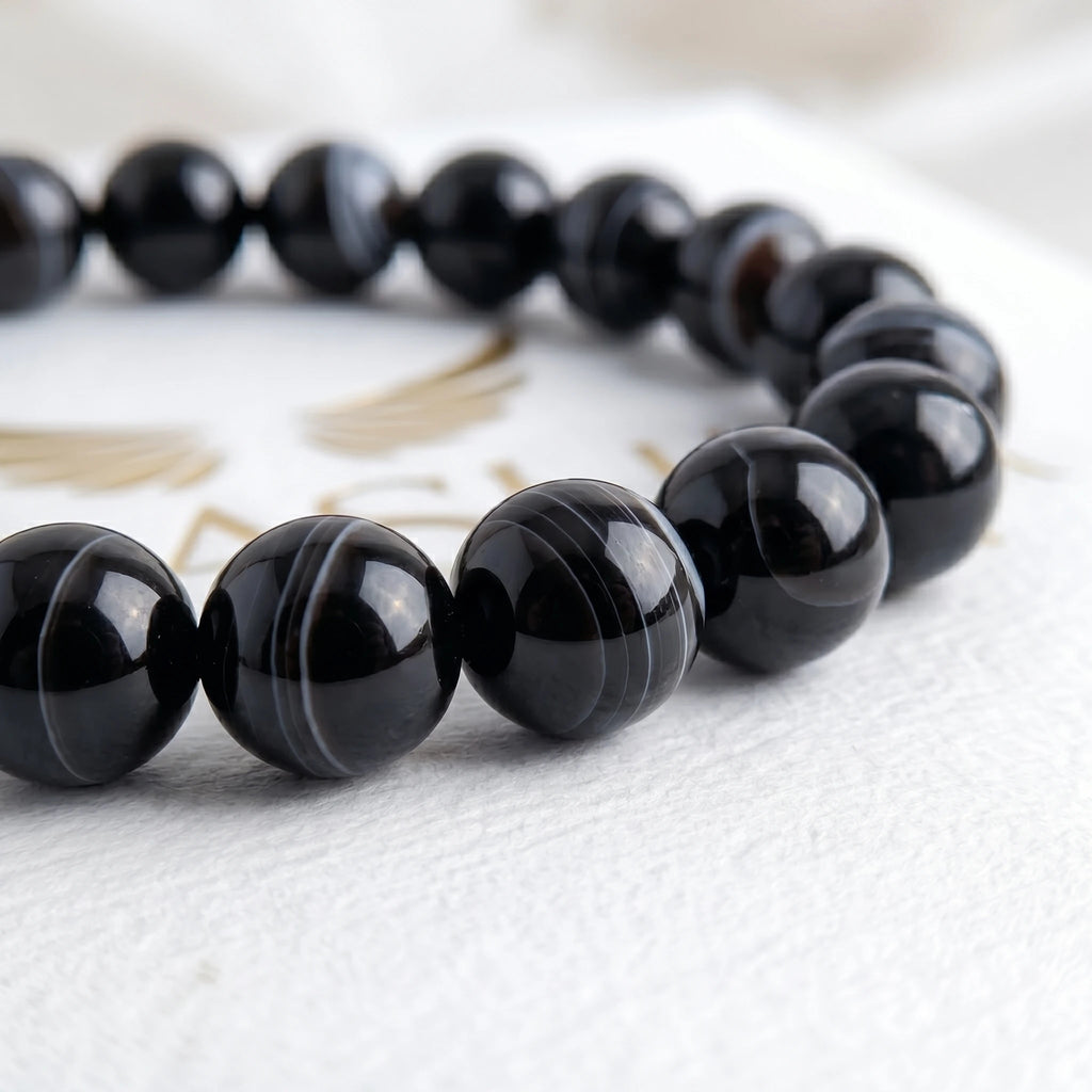 black agate bracelet natural stone beads close up swirl pattern detail