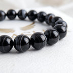 black agate bracelet natural stone beads close up swirl pattern detail