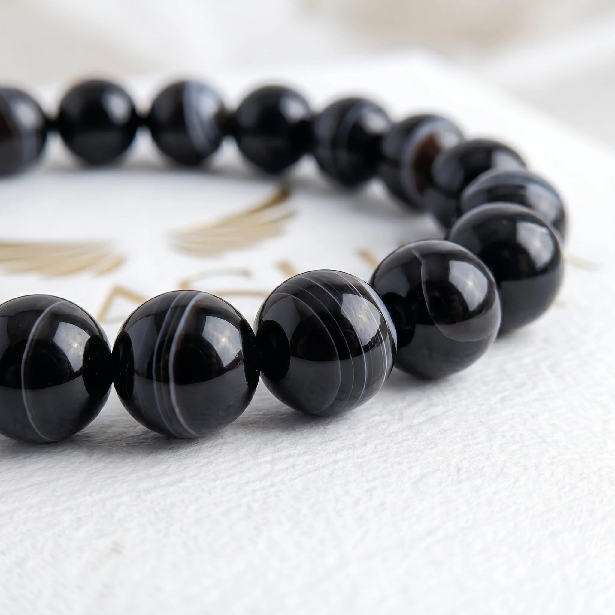 black agate bracelet natural stone beads close up swirl pattern detail