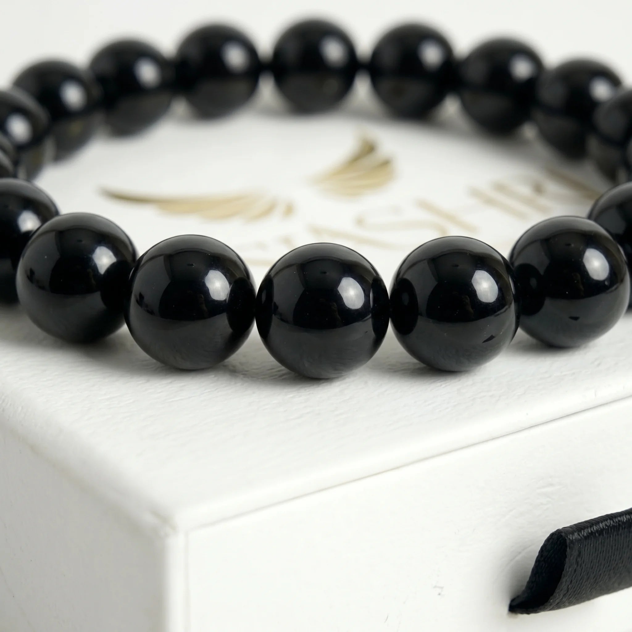 Black agate bead bracelet close up – deep black natural gemstone beads