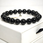 Back view of the black agate bracelet showing the durable elastic stretch cord.