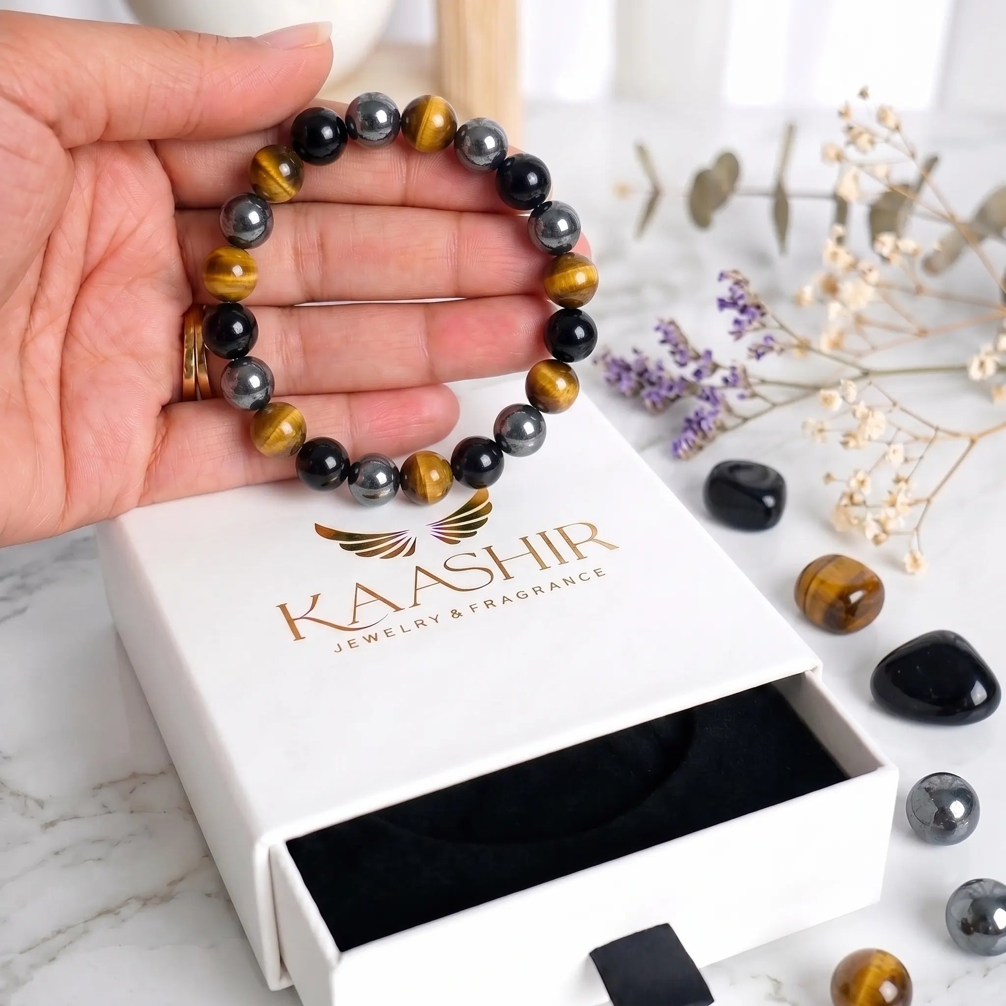 Polished black obsidian beads detail in triple protection bracelet