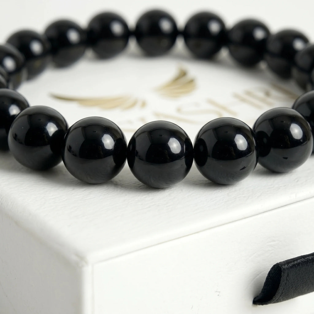 black obsidian bracelet natural stone beads close up volcanic glass