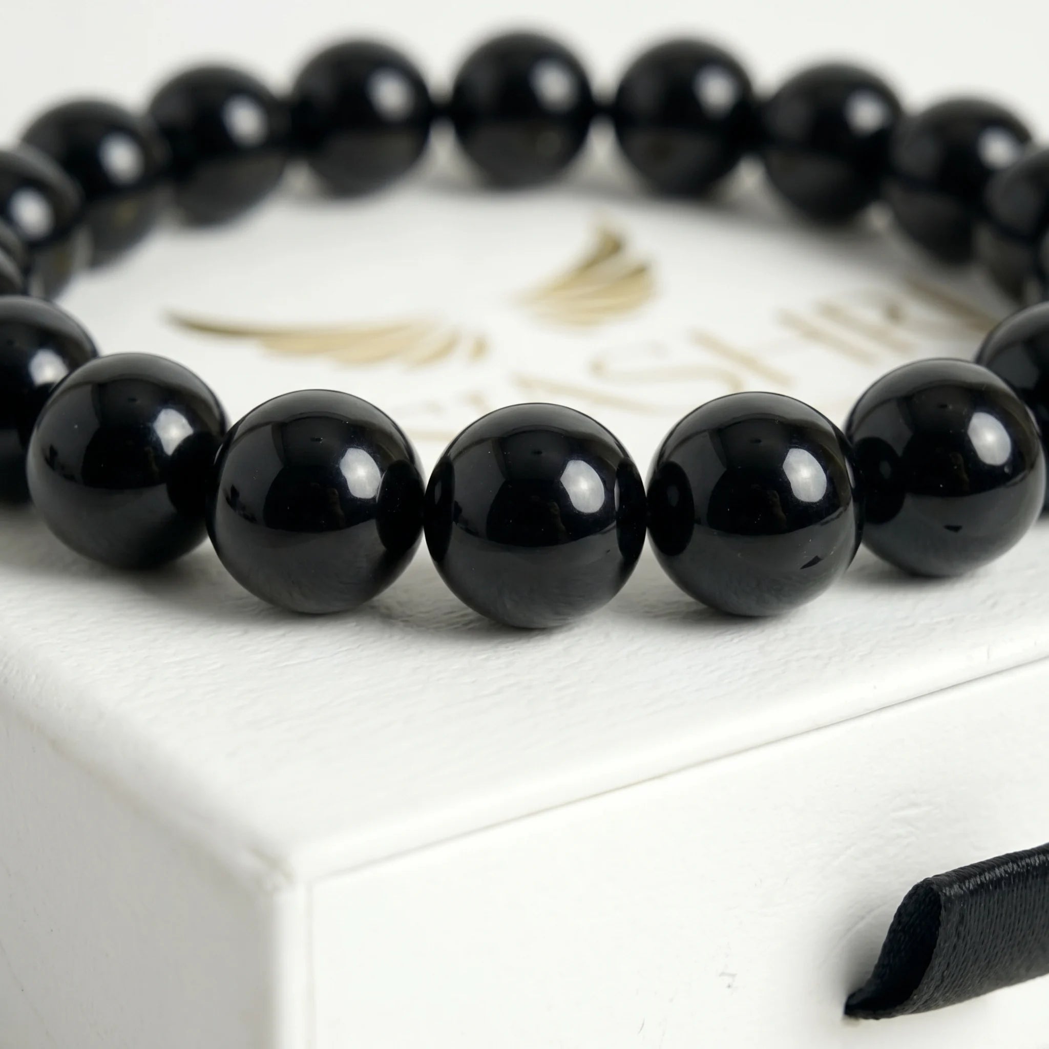 black obsidian bracelet natural stone beads close up volcanic glass