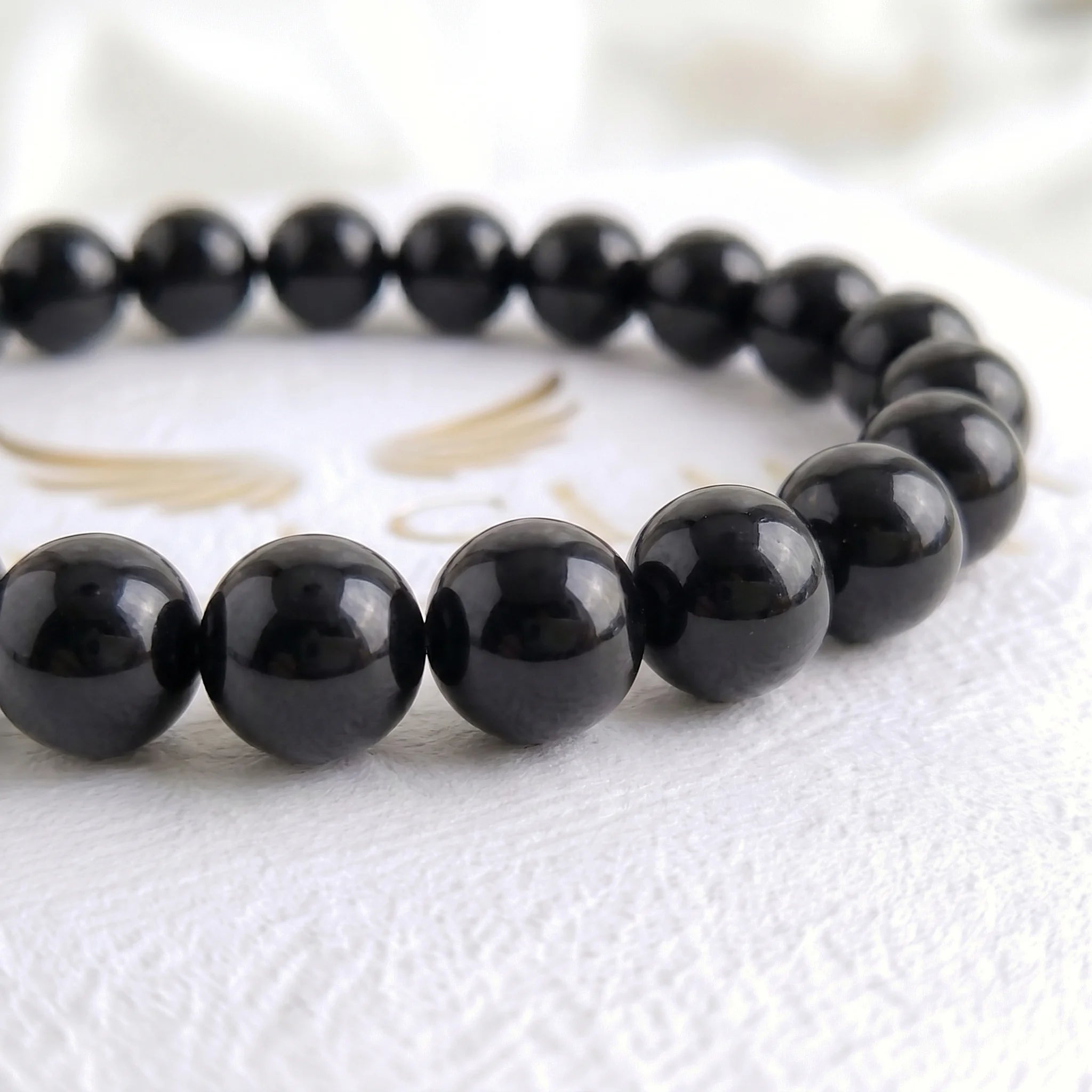 black obsidian bracelet natural stone beads close up volcanic glass