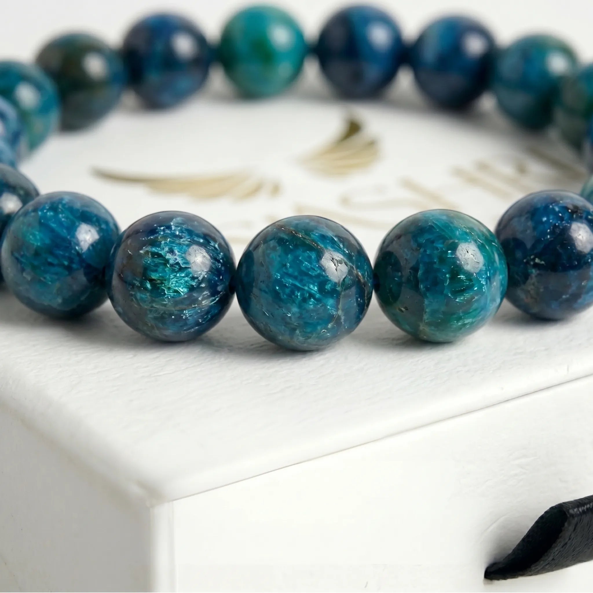 blue apatite bracelet natural stone beads close up teal blue detail