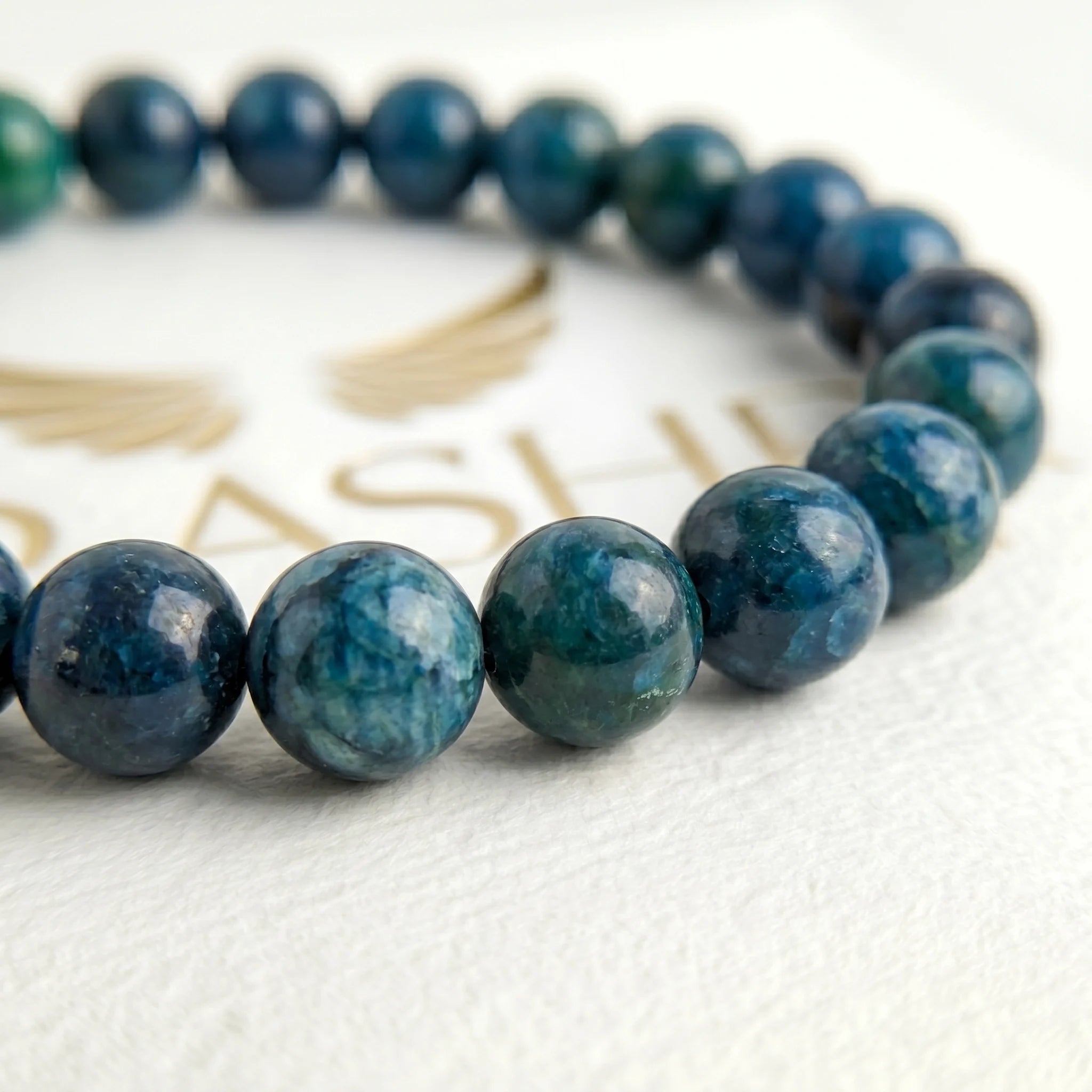 blue apatite bracelet natural stone beads close up teal blue detail