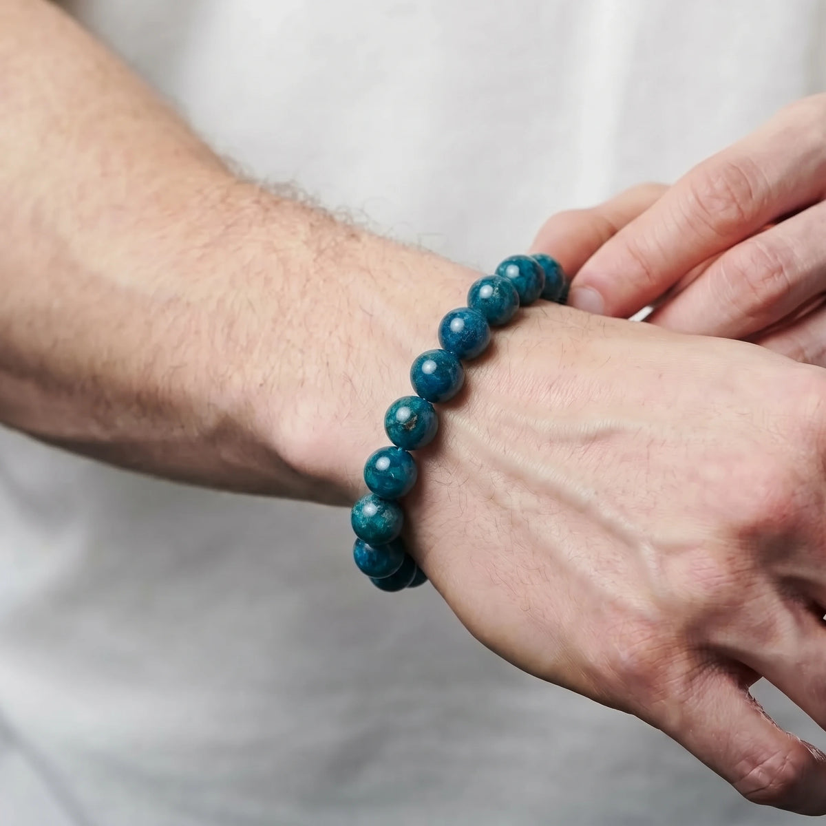 Blue Apatite 10mm Beaded Gemstone Bracelet worn on wrist – Kaashir
