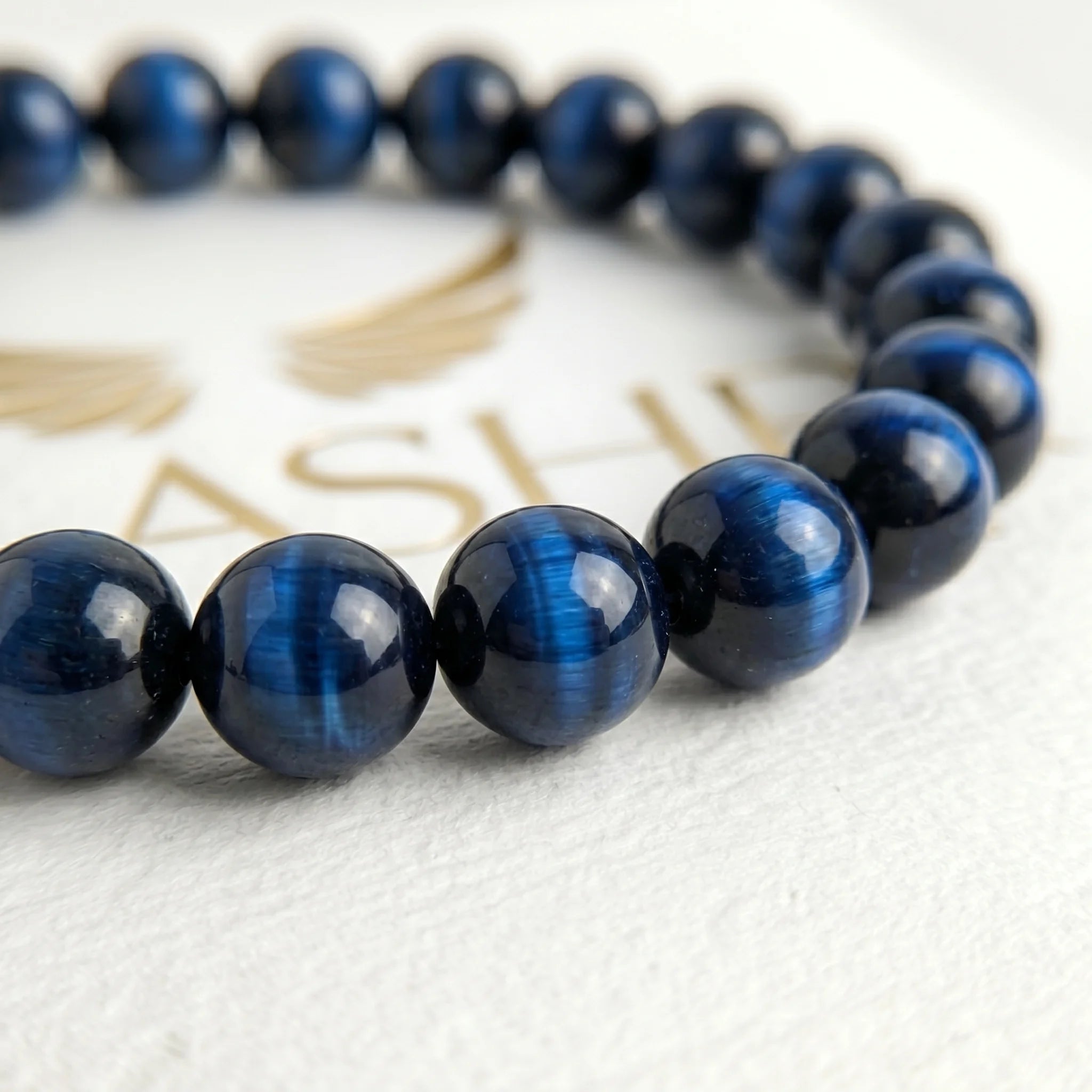 blue tiger eye bracelet natural stone beads close up detail