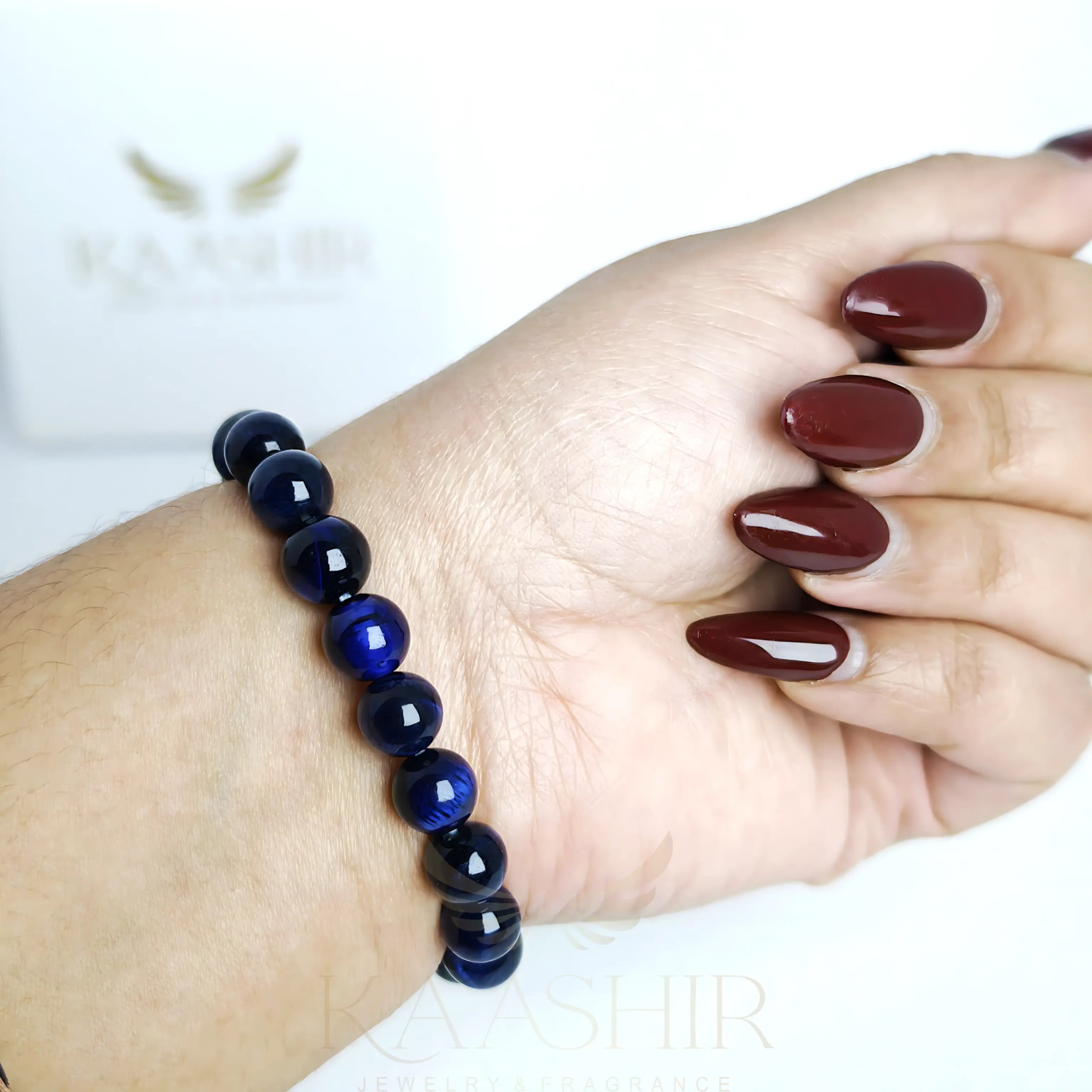 Blue Tiger Eye bracelet worn on wrist for a bold and confident look