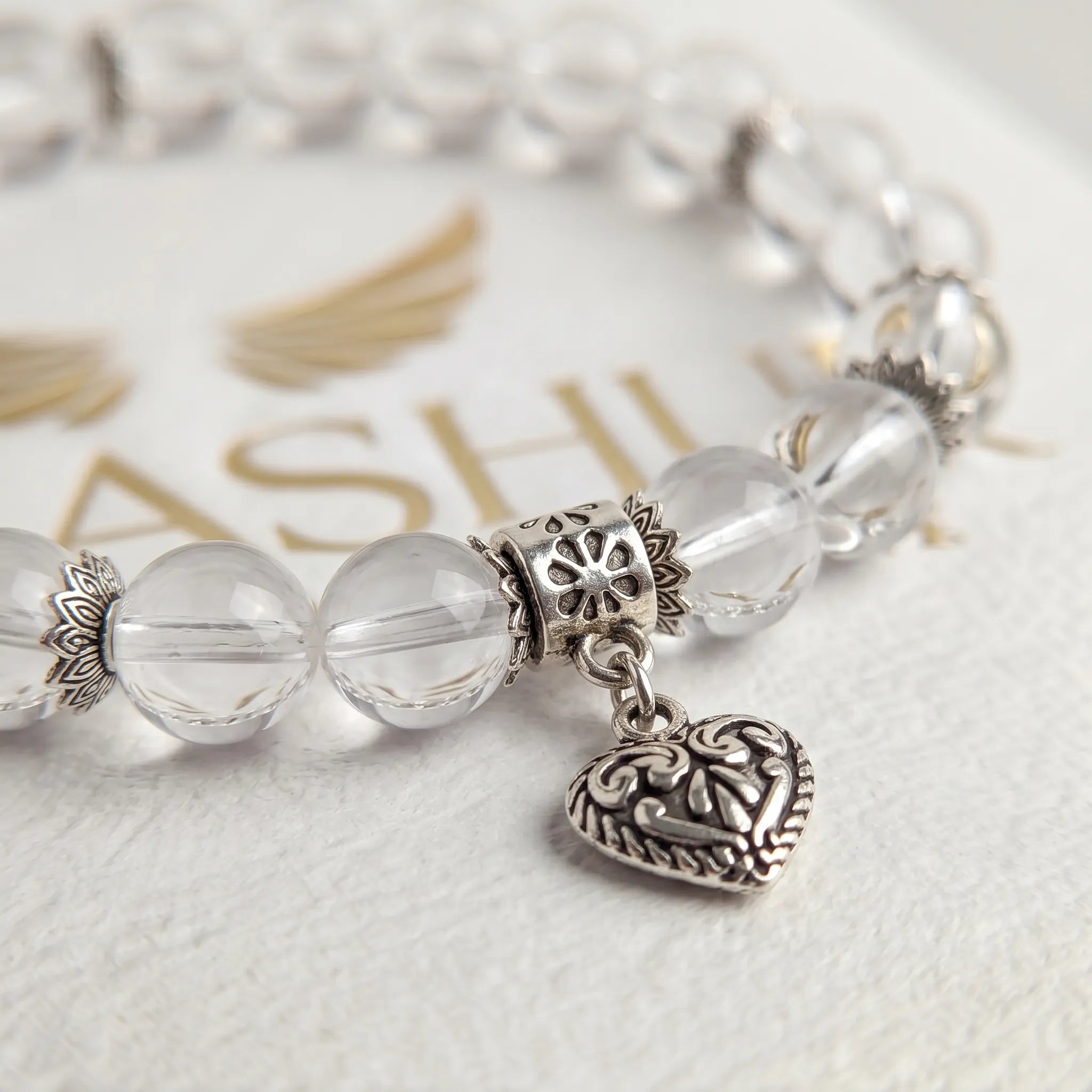 Natural clear quartz crystal charm bracelet bead detail — genuine transparent gemstone Kaashir