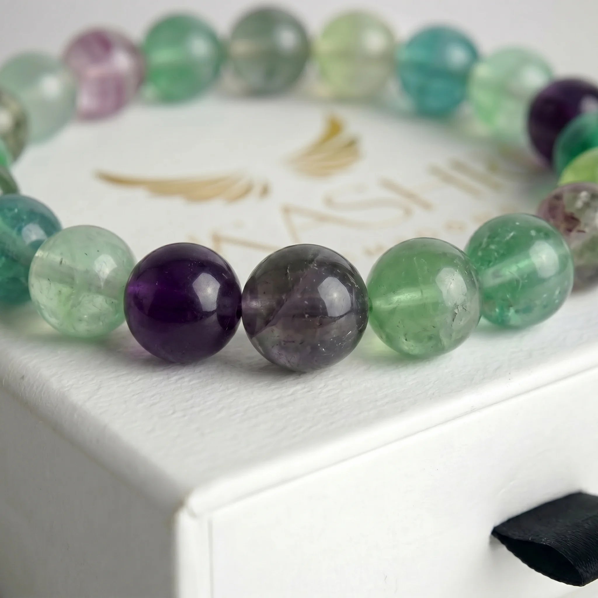fluorite bracelet natural stone beads close up multicolor purple green