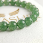 green aventurine bracelet natural stone beads close up green shimmer