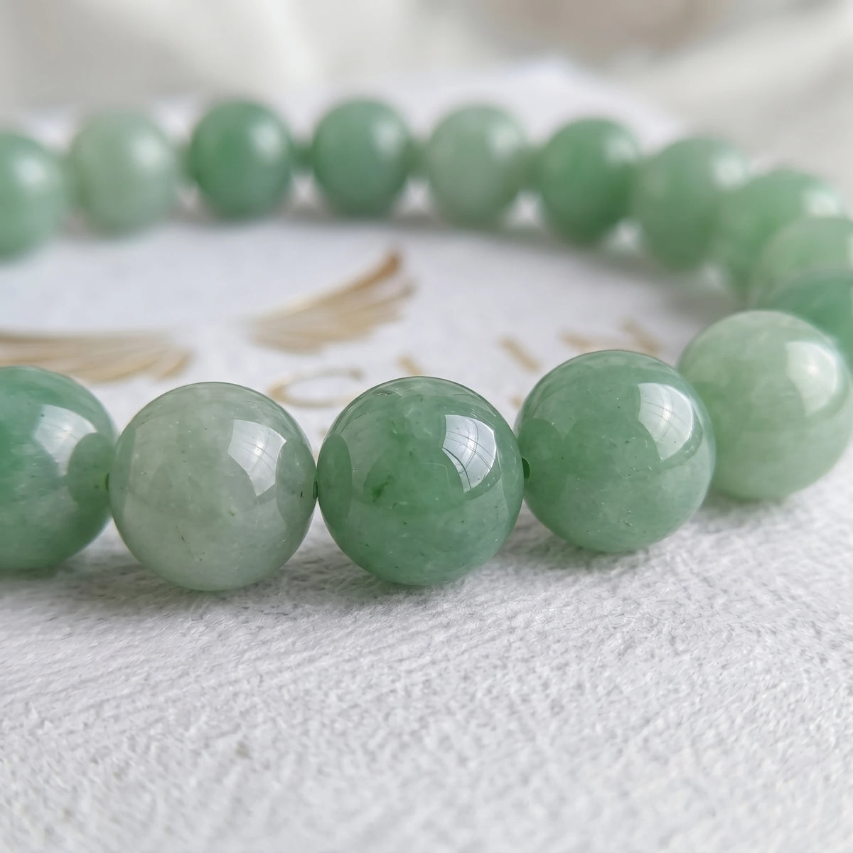 green aventurine bracelet natural stone beads close up green shimmer