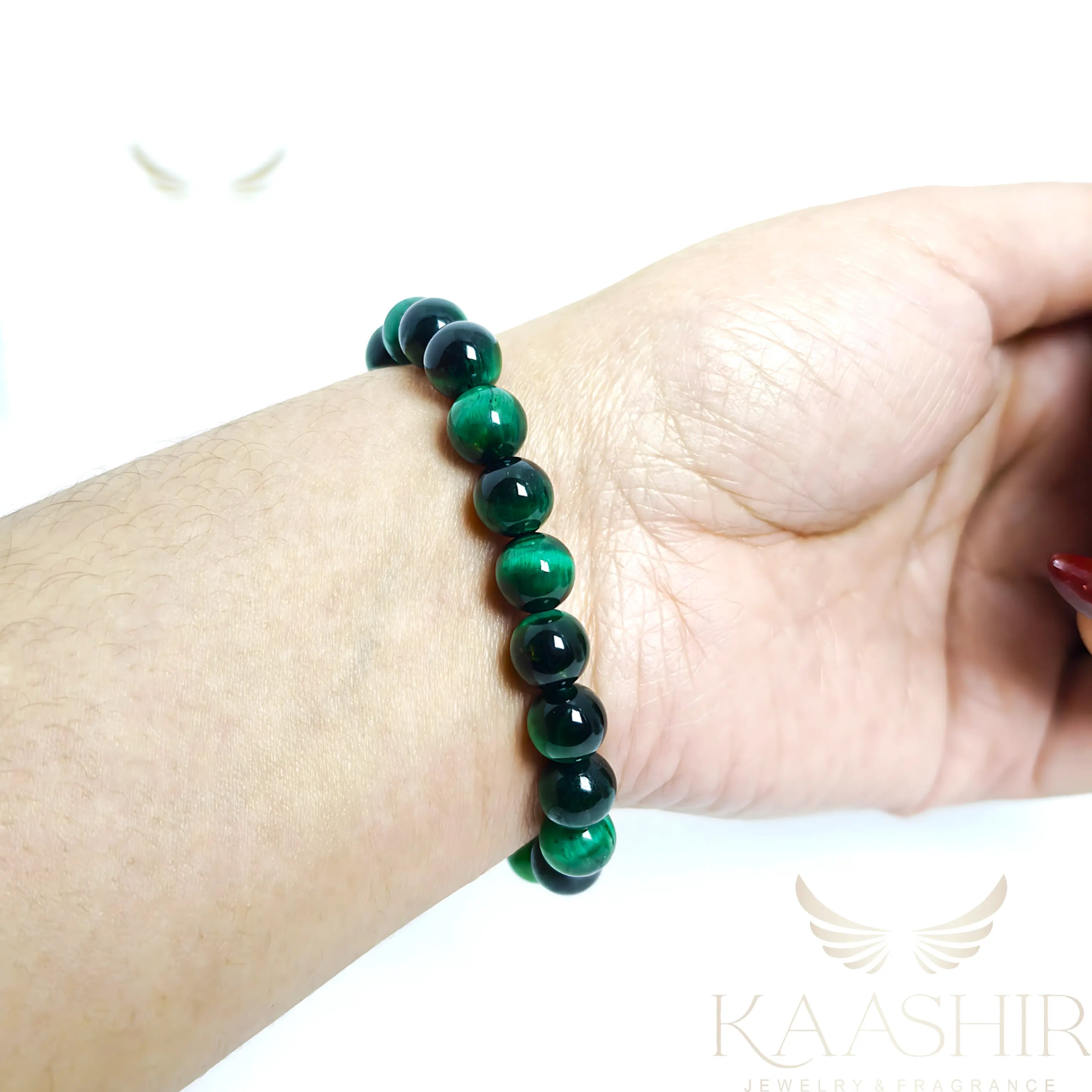 green tiger eye bracelet worn on wrist healing crystal growth