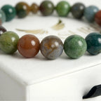 agate bracelet natural stone beads close up earthy multicolor detail