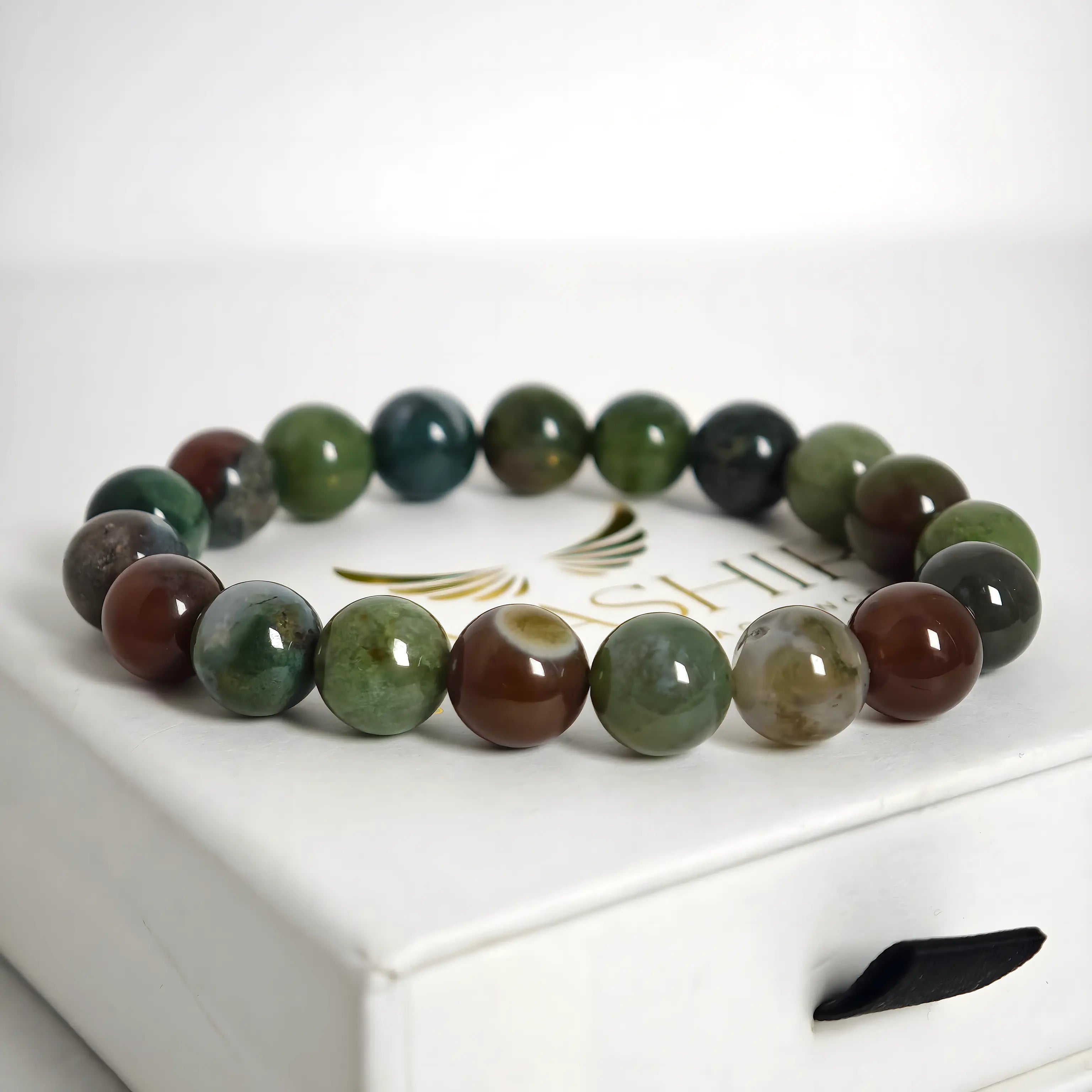 Close up of Indian agate beads showing natural stone texture and colors