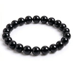 Kaashir Black Agate natural gemstone beaded bracelet with high-gloss finish on white background