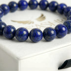 lapis lazuli bracelet natural stone beads close up blue gold detail