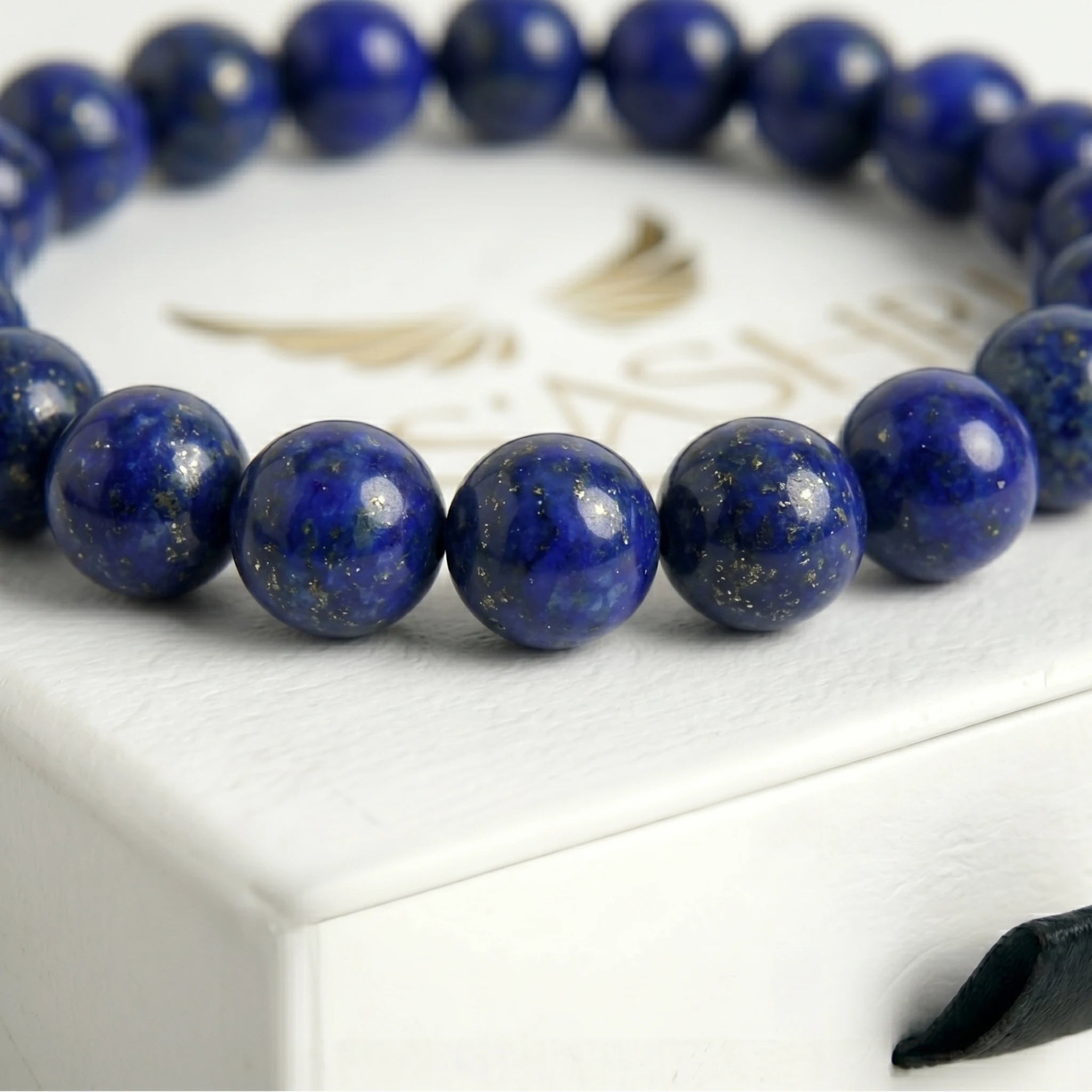 lapis lazuli bracelet natural stone beads close up blue gold detail