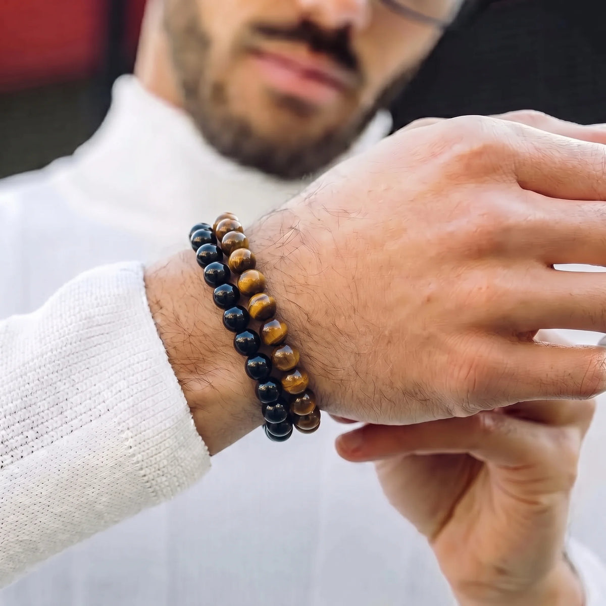 Man wearing Tiger Eye and Black Obsidian gemstone bracelets together