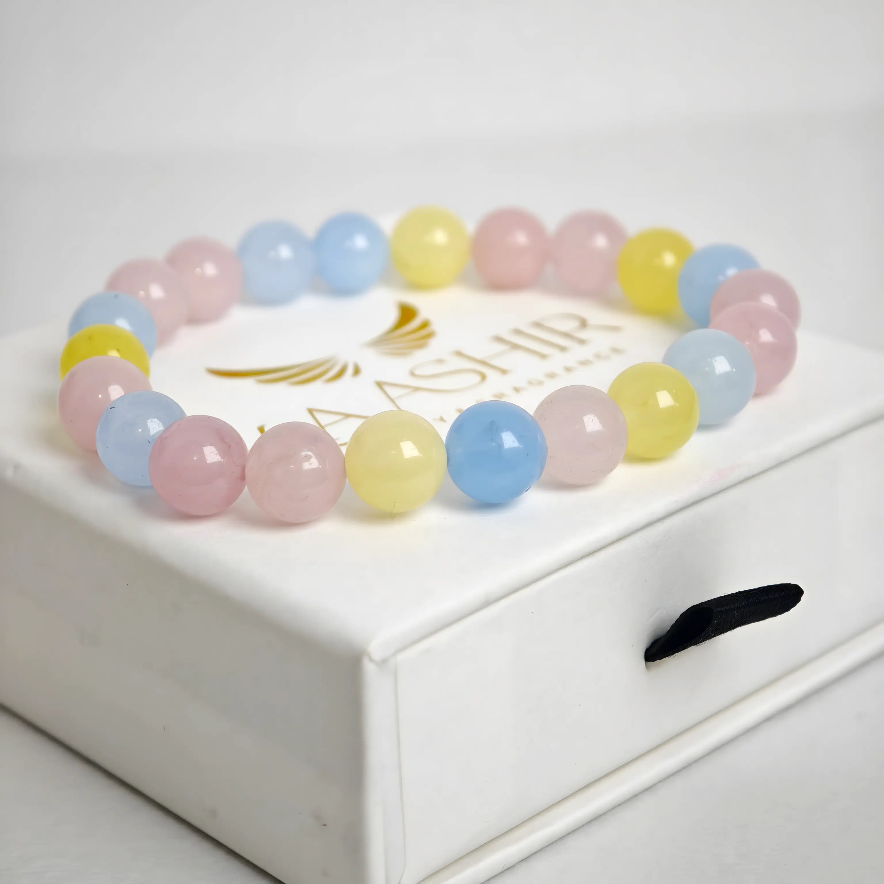 multi morganite bracelet natural stone beads close up pink peach tones