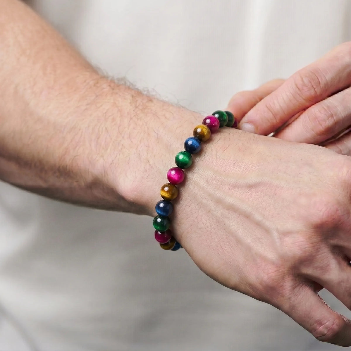 Multi Tiger Eye Yellow Green Blue Pink 8mm Beaded Gemstone Bracelet worn on wrist – Kaashir Jewelry
