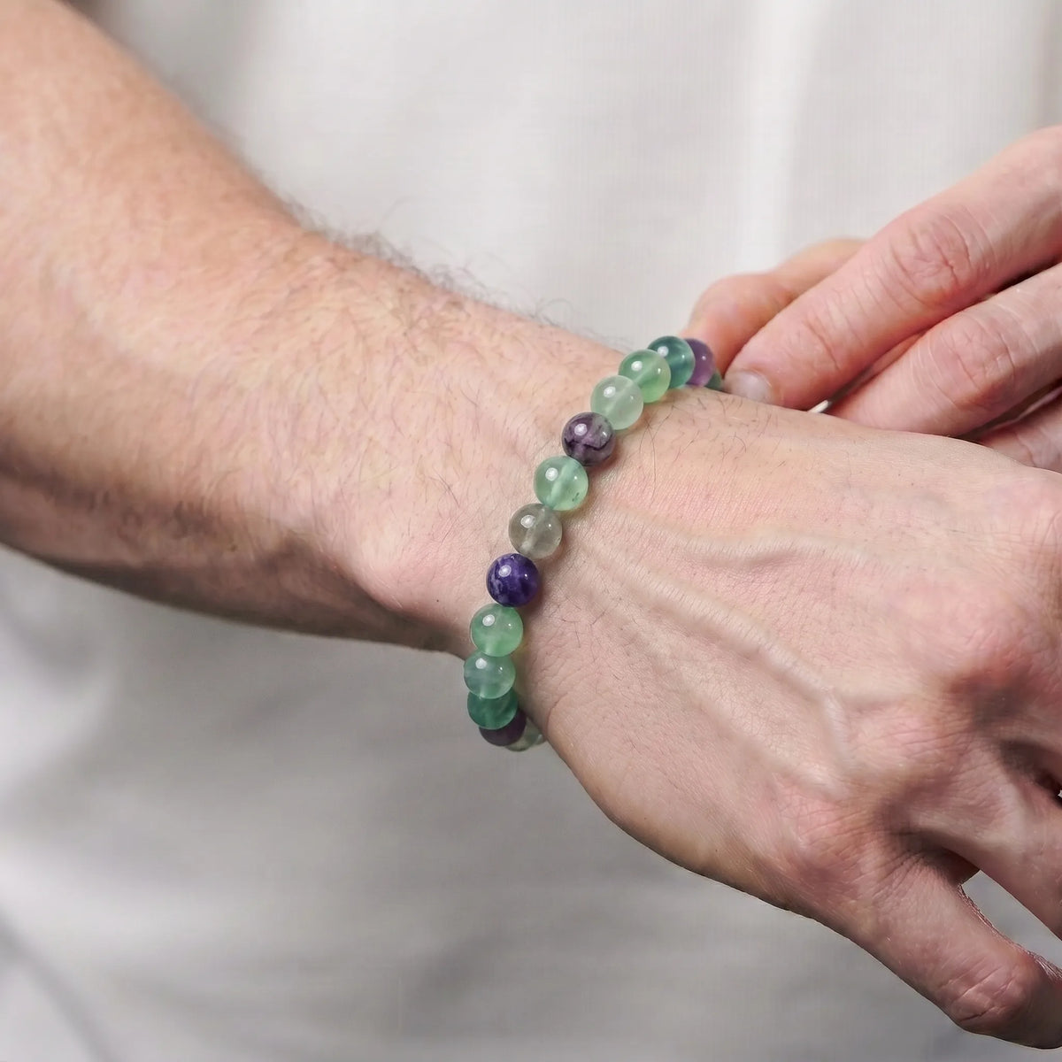 Rainbow Fluorite 8mm Beaded Gemstone Bracelet worn on wrist – Kaashir Jewelry
