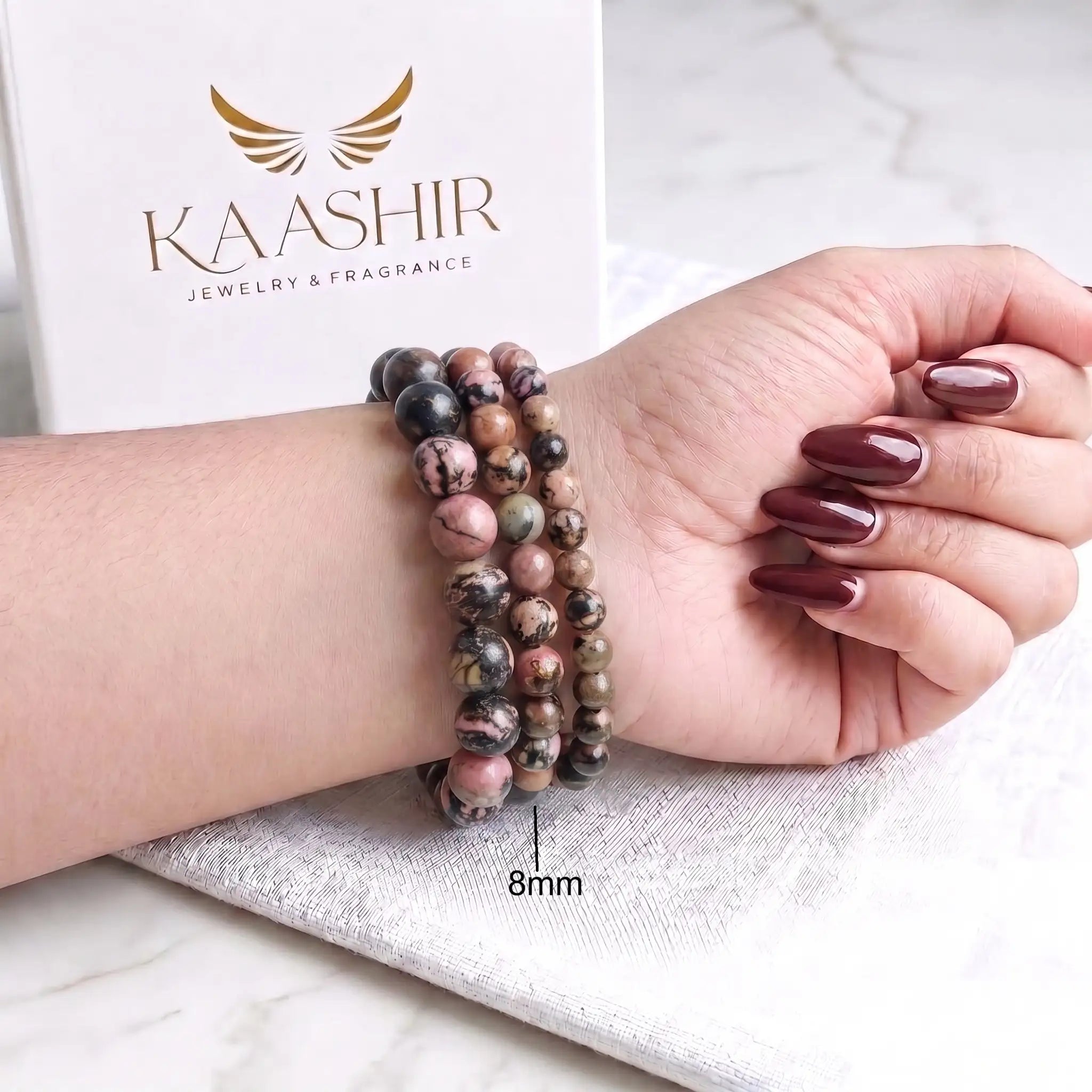 Rhodonite bracelet 8mm beads worn on wrist — everyday self-love gemstone bracelet