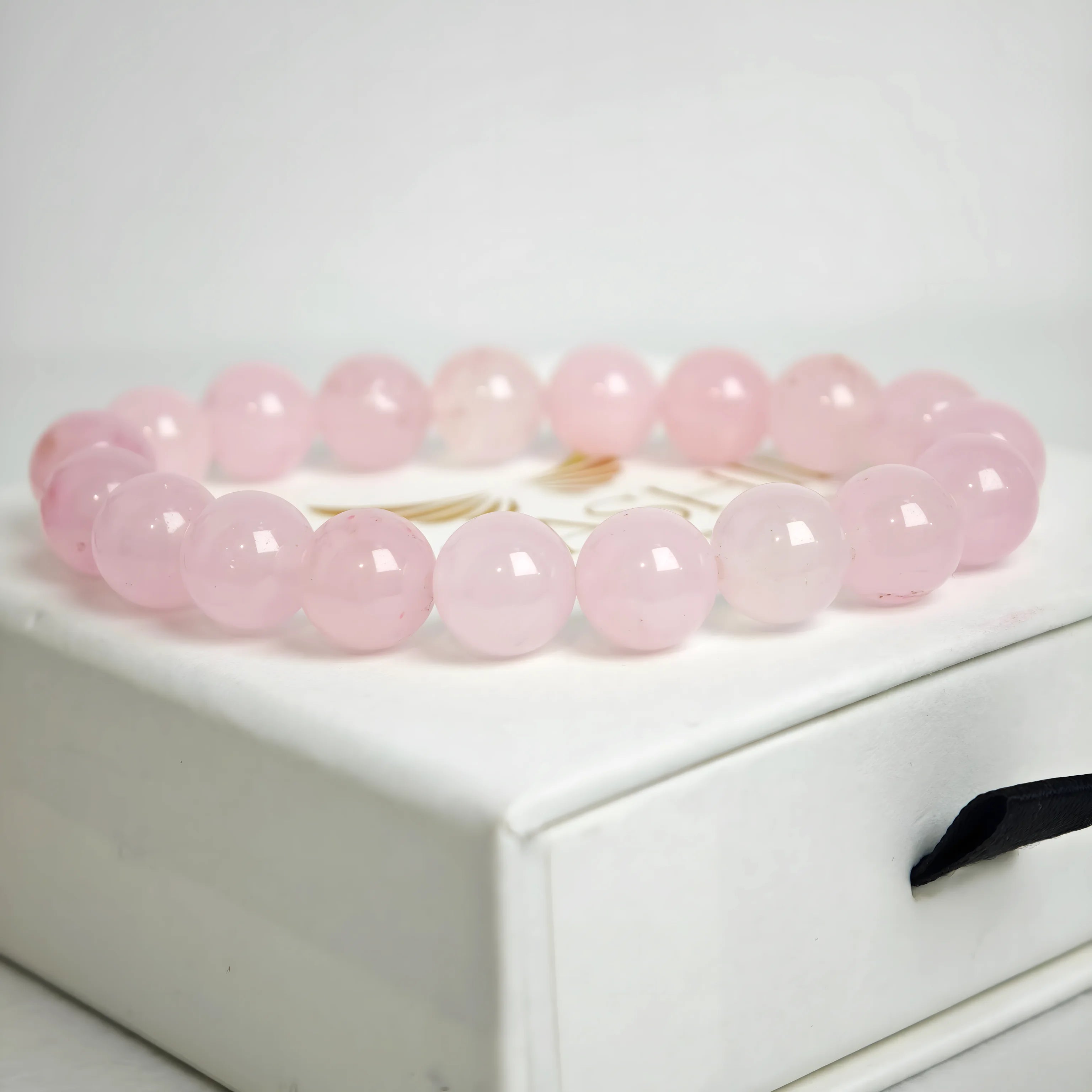 rose quartz bracelet natural stone beads close up pink detail