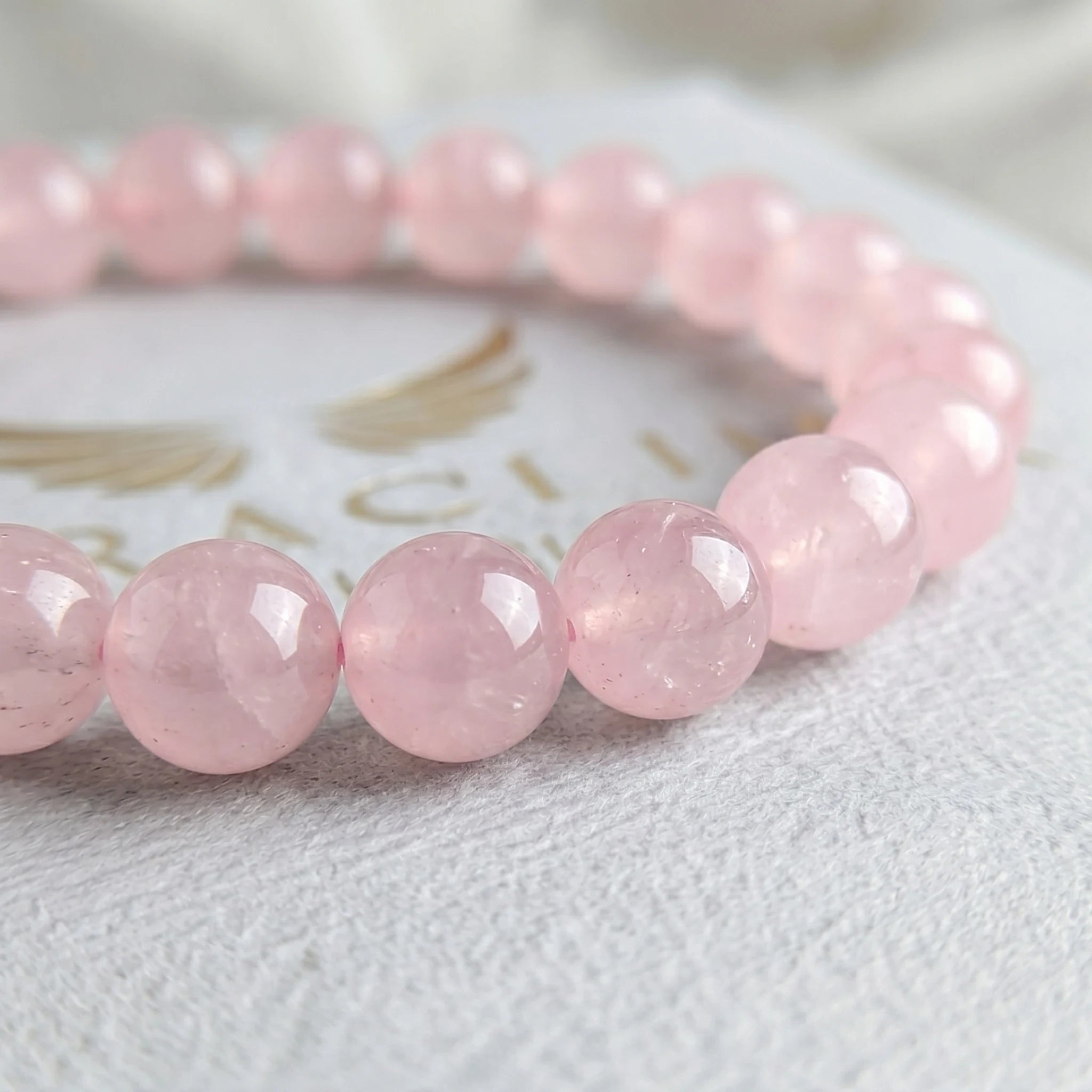 rose quartz bracelet natural stone beads close up pink detail