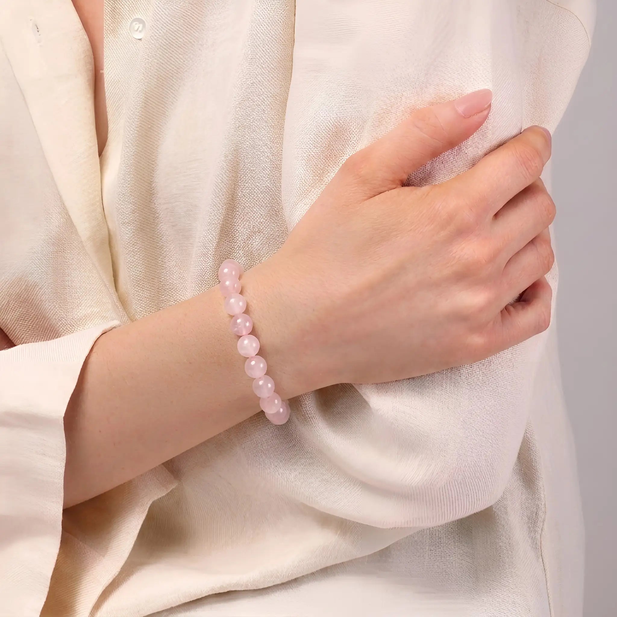rose quartz bracelet worn on wrist love peace positive energy