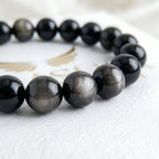 silver obsidian bracelet natural stone beads close up silver shimmer