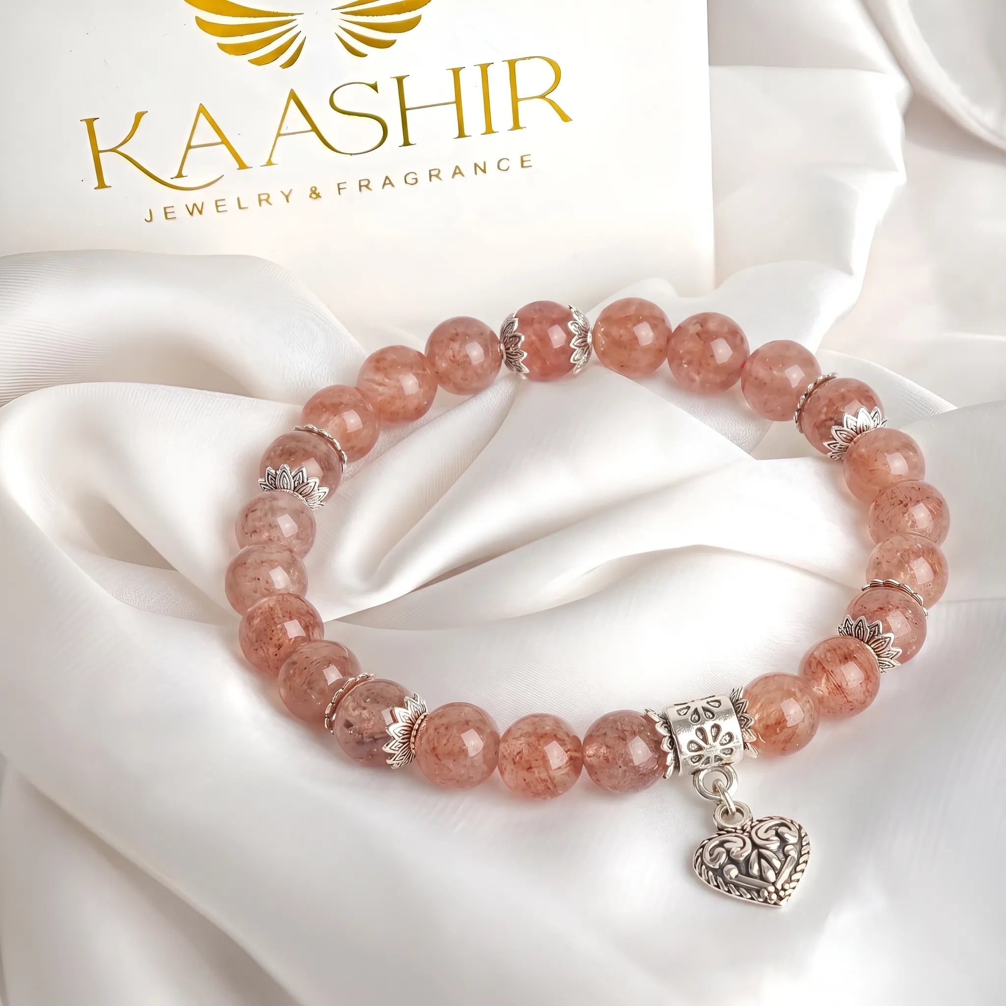 Sterling silver ornate heart charm on strawberry quartz beaded bracelet — handmade by Kaashir