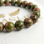 unakite bracelet natural stone beads close up green salmon pink detail